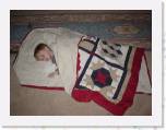 1stquiltinuse * December 25, 2004
Our little peanut just had a ball opening everyones presents this year. :) That was the most fun. :) He actually fell asleep while eating Christmas Dinner. So, I picked him up and asked mom for a blanket to lay him in. And, what does she bring out??? My very first quilt I ever made! So, naturally, I had to get a picture of it,
because I never did get one before. * 500 x 375 * (69KB)